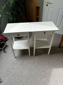 Two white Ikea Hemnes bedside tables