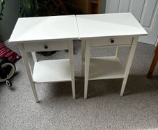 Two white Ikea Hemnes bedside tables