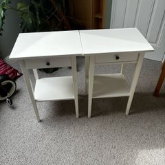 Two white Ikea Hemnes bedside tables