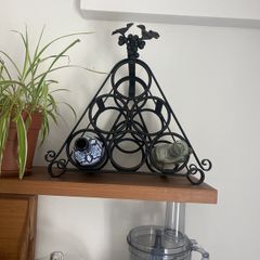 Black wrought iron wine rack