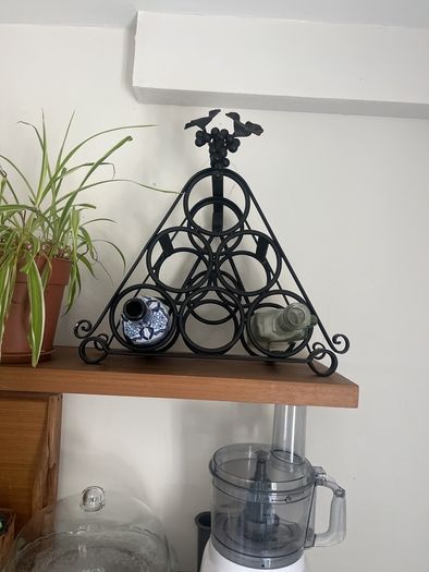 Black wrought iron wine rack