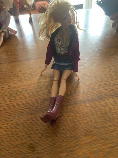 barbie with purple boots and jacket