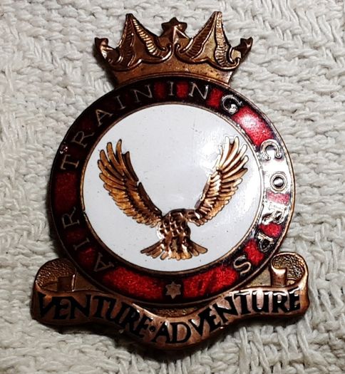 A T C badge