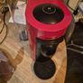 nespresso vertuo plus machine and coffee pods with holding tray Image 2