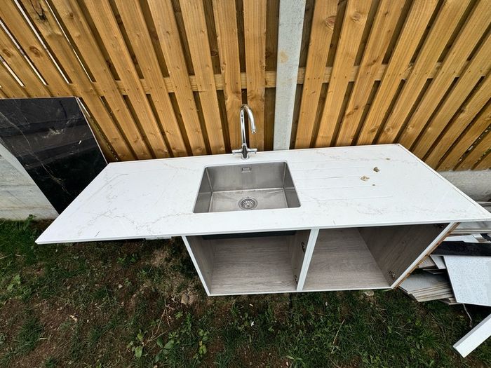 Narrow Sink Along With Vanity Unit And Pipes; Kitchen Sink And Quartz Worktop Unit With Wooden Inparts