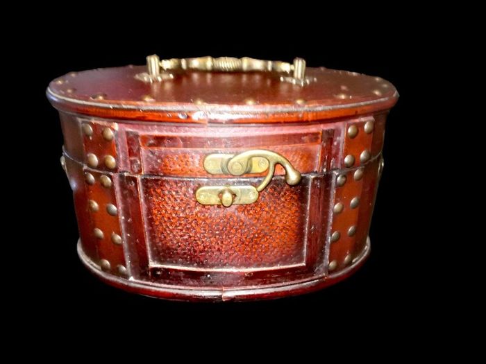 Leather covered antique box with brass