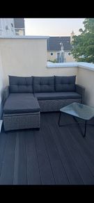 Rattan garden sofa and table