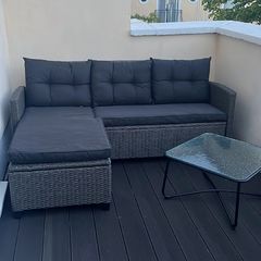 Rattan garden sofa and table
