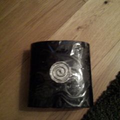Black candle with silver circle