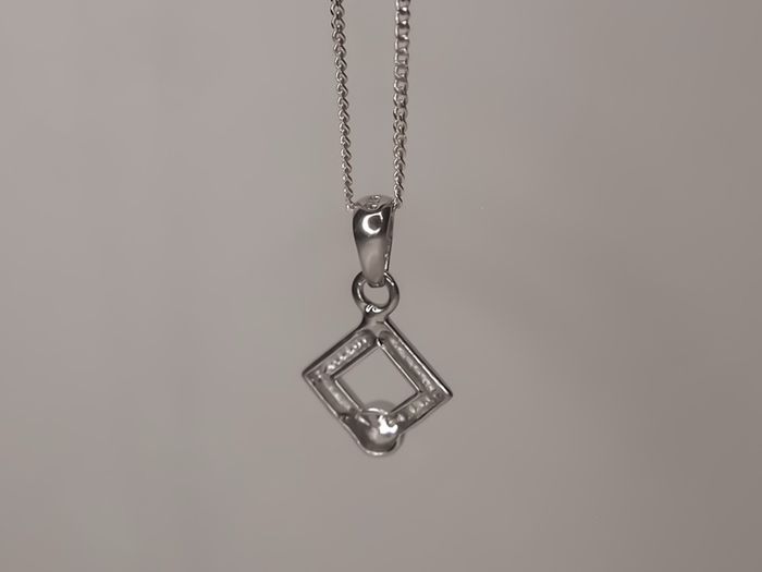 Sterling silver square pendant with a cz stone