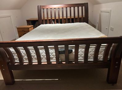 Wooden bed frame with slatted headboard and footboard