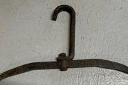 Two antique cast iron implements