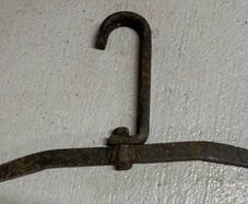 Two antique cast iron implements