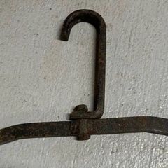 Two antique cast iron implements