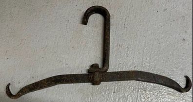 Two antique cast iron implements