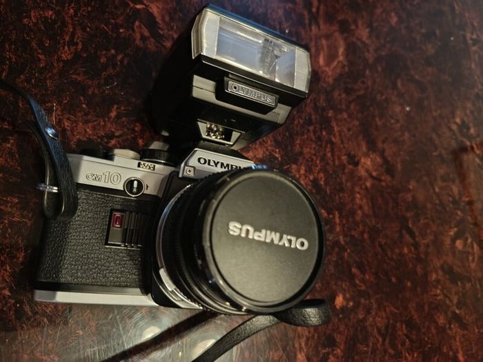 Olympus OM 10 camera with flash