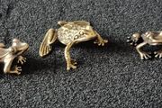 3 brass frogs,. Solid brass.