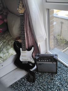 electric guitar and a compact practice amplifier from Gear4music