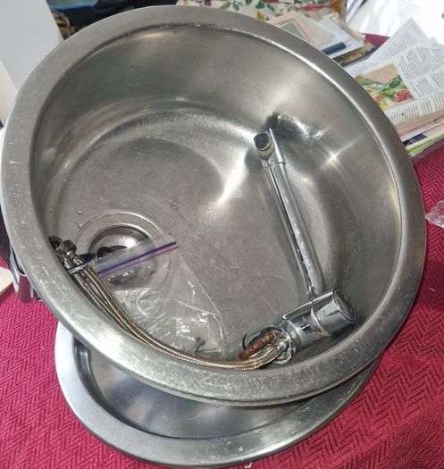 Round sink and tap