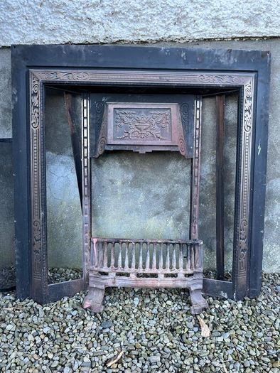 Wooden fireplace surround with carved details