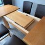 Oak extendable dining table + chairs Image 6