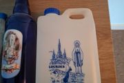 Empty holy water bottles and other religious items