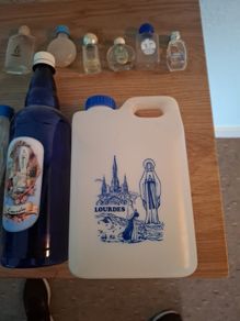 Empty holy water bottles and other religious items