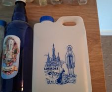 Empty holy water bottles and other religious items