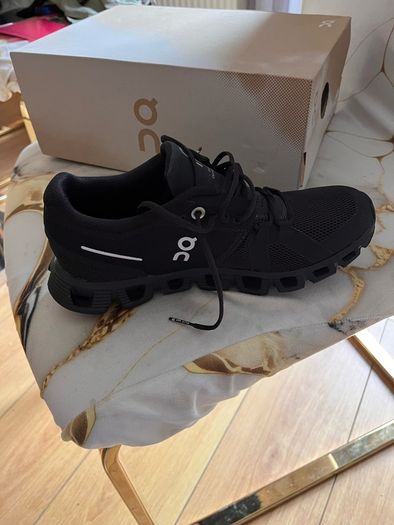 Two pairs of runners boys Nike size 4 on clouds size 3 and under armour jacket age 10-12