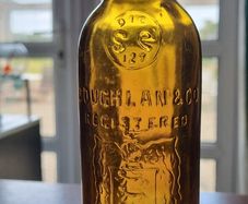 Coughlan Macroom amber pictorial bottle