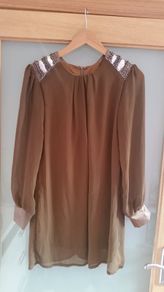 Brand New. Chiffon top with sequined shoulders