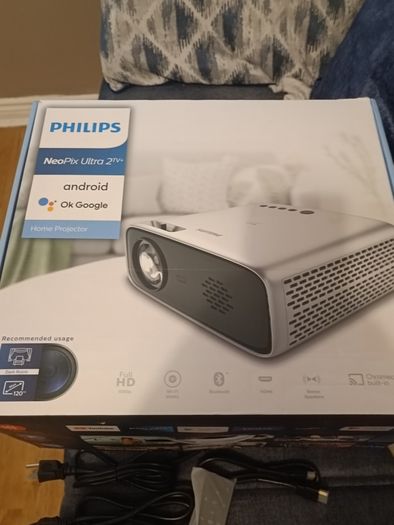 philips neopix ultra 2tv+ home projector and height adjustable stand, built in speakers and android TV with play store stand comes with power point bracket on it as seen in pictures also remote and phone holder