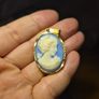 Vintage Cameo Goldtone Pendant on a Blue Background Image 7