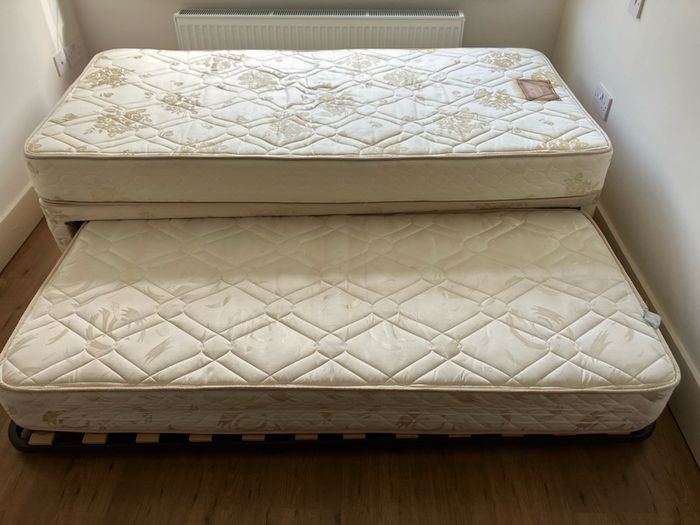 Single bed with pullout bed underneath