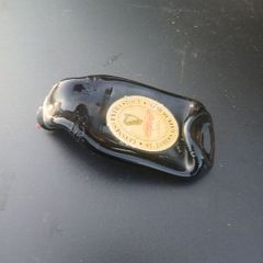 melted guiness bottles