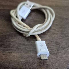 USB-A to Micro-USB charging cable.