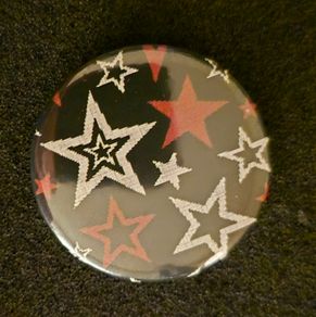 Star , pin back button badge.