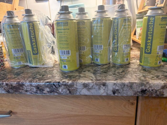8 Camping gas canisters.
