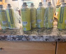 8 Camping gas canisters.