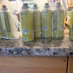 8 Camping gas canisters.