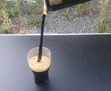 guiness can pouring illusion