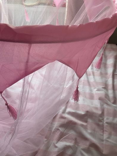 Beautiful pink tulle princess bed canopy.