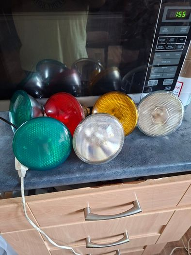 Large Theatrical or Display Lighting, including reflector lamps and colored PAR-style bulbs, with various lamp holders, plugs, and coiled electrical leads all working