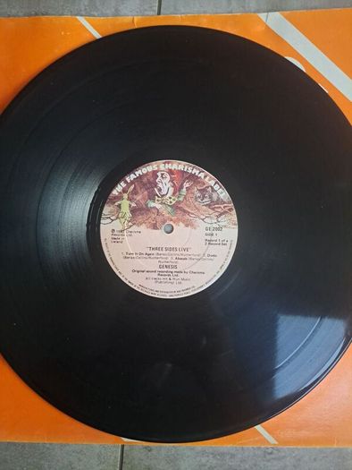 Genesis three sides live . Irish press on The famous Charisma label No sleeve . record 1 of a 2 record set