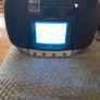 vintage Amstrad CDTV50, a portable boombox featuring a built-in CRT television, radio, and CD player. Image 2