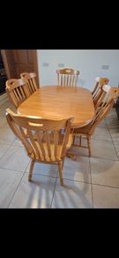 solid oak extendable table and six chairs