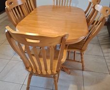 solid oak extendable table and six chairs