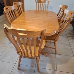 solid oak extendable table and six chairs