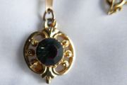 Gold Plated Necklace with Purple Stone. Stone is Multifaceted &amp; Sparkles in the Light.