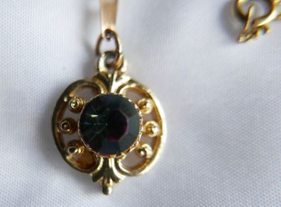 Gold Plated Necklace with Purple Stone. Stone is Multifaceted & Sparkles in the Light.
